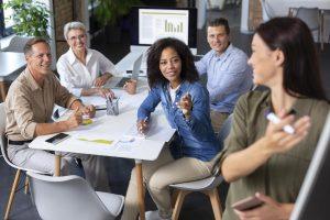 Business team discussing a plan around a meeting table