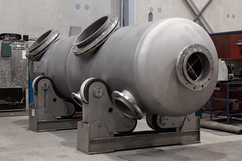 Diagram of pressure vessel components showing welds, nozzles, and support structures designed to meet AS 1210 requirements in Australia.