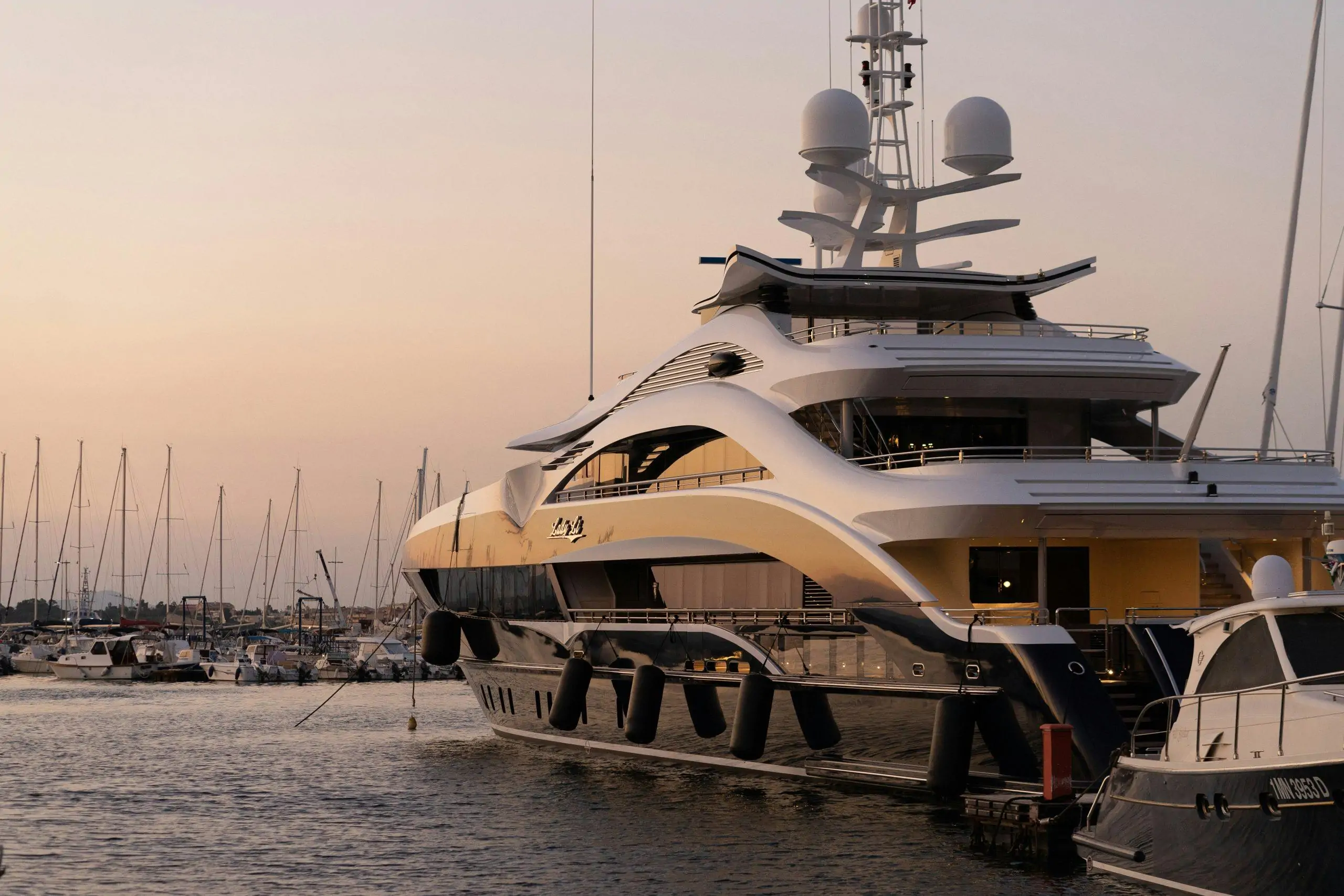 Large motor yacht moored in a marina