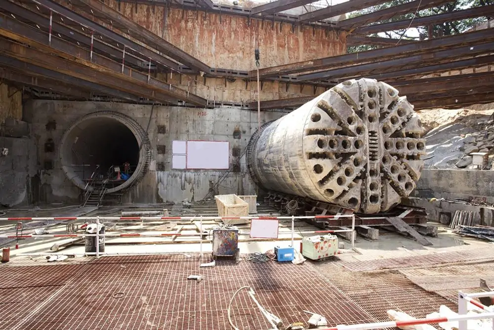 Tunnel boring machine positioned at the entrance to an underground tunnel