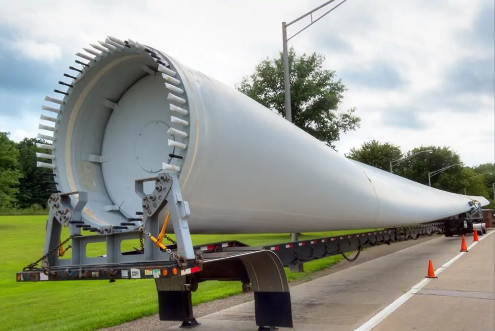 Wind turbine blade transported on an oversized road trailer