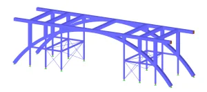 Engineer using structural analysis software integrated with BIM and CAD platforms on a computer workstation.